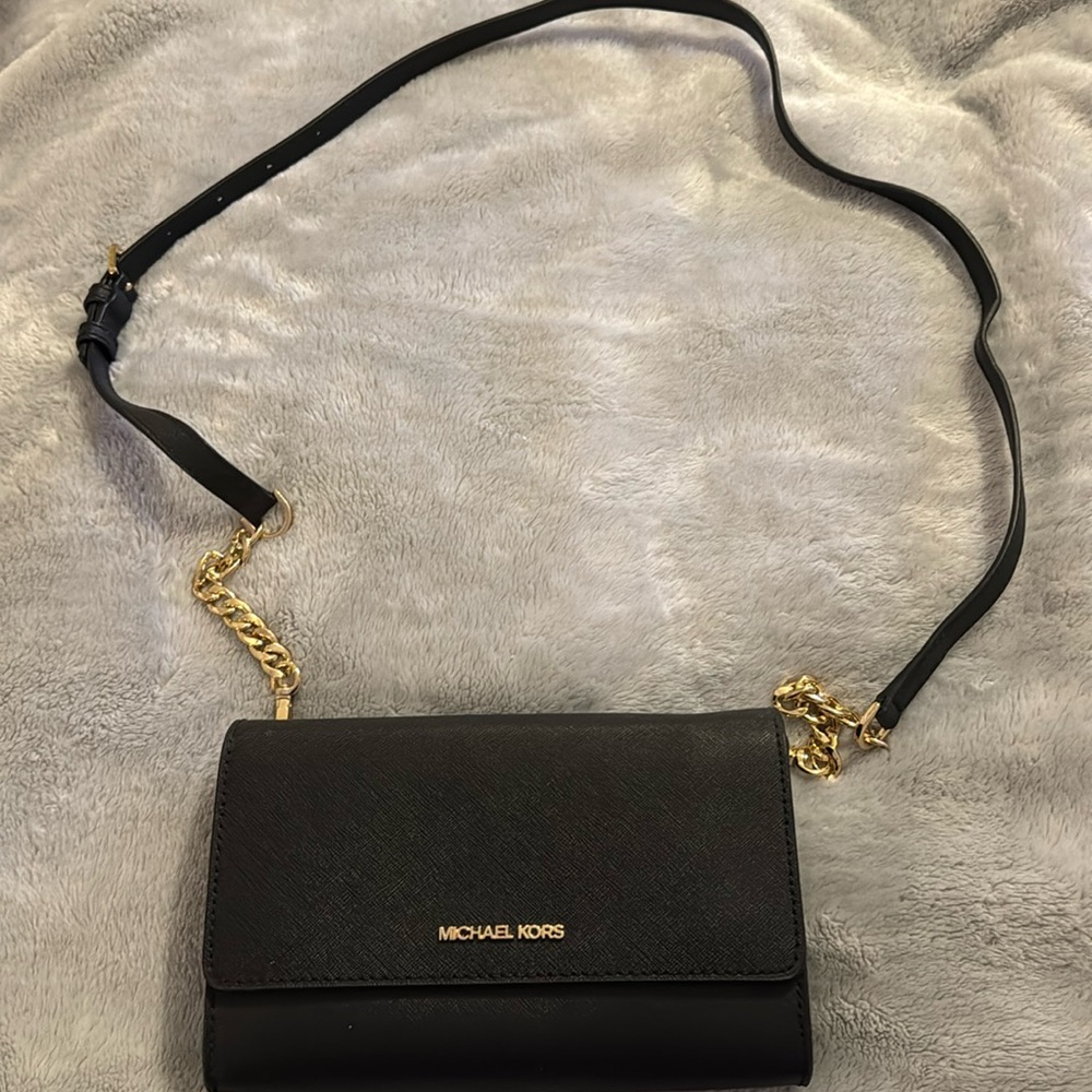 Brand New crossbody with removable clutch/wallet.